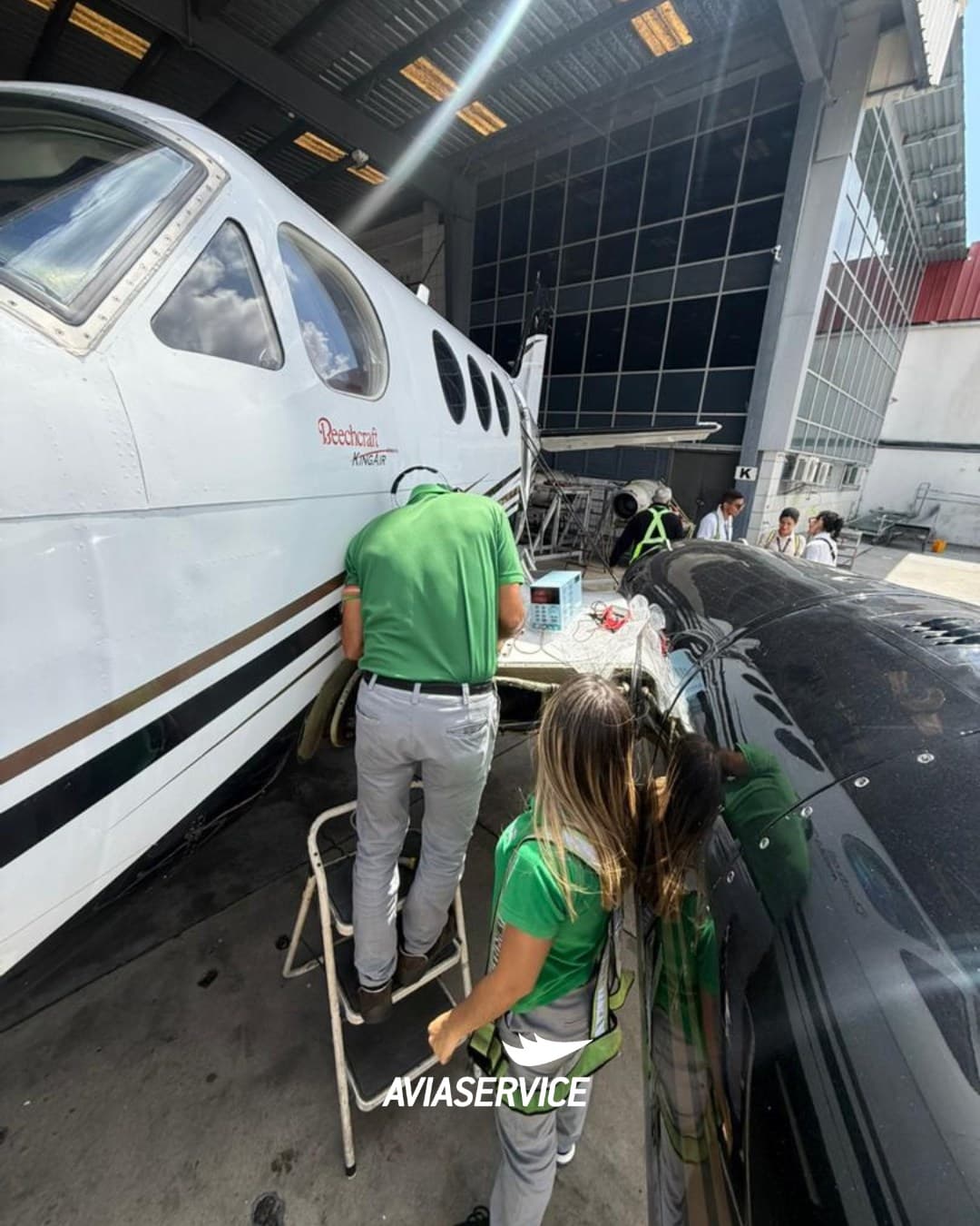 Aviaservice technicians working on aircraft